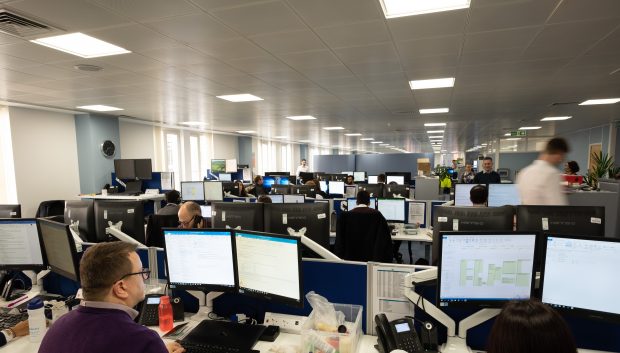 View of computers and people in a modern office