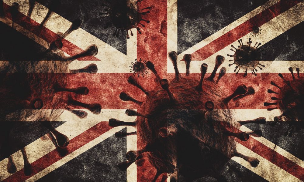 Depiction of COVID-19 viruses superimposed on a Union flag.