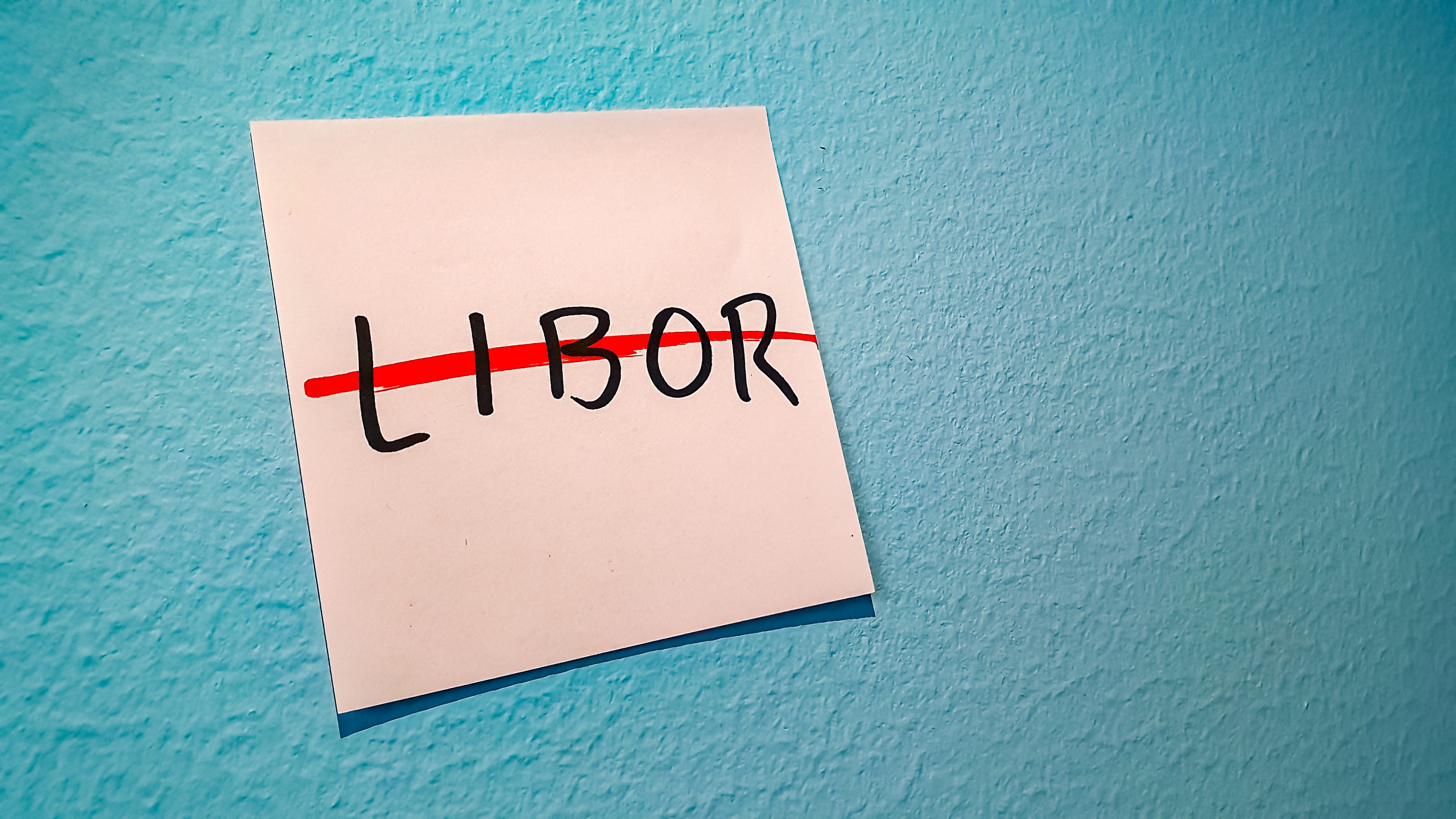 Sticky note with work LIBOR crossed out in red
