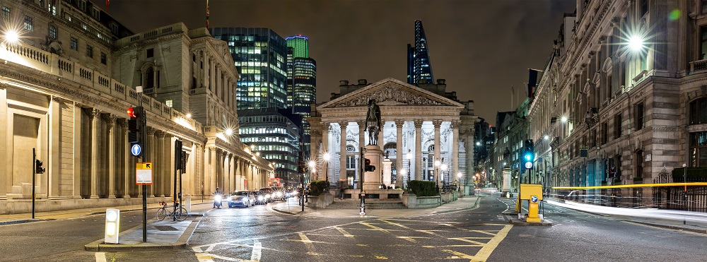 Image of the Royal Stock Exchange in London, taken at night.