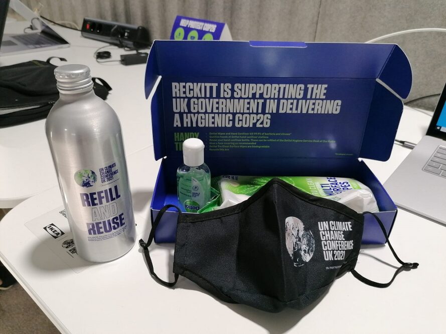 Image of branded products (water bottle, face mask and hand sanitiser) available to attendees at the COP26 conference.