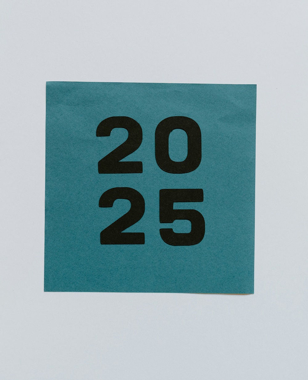 The numbers '2025' are in bold black on a green square. Credit: Unsplash