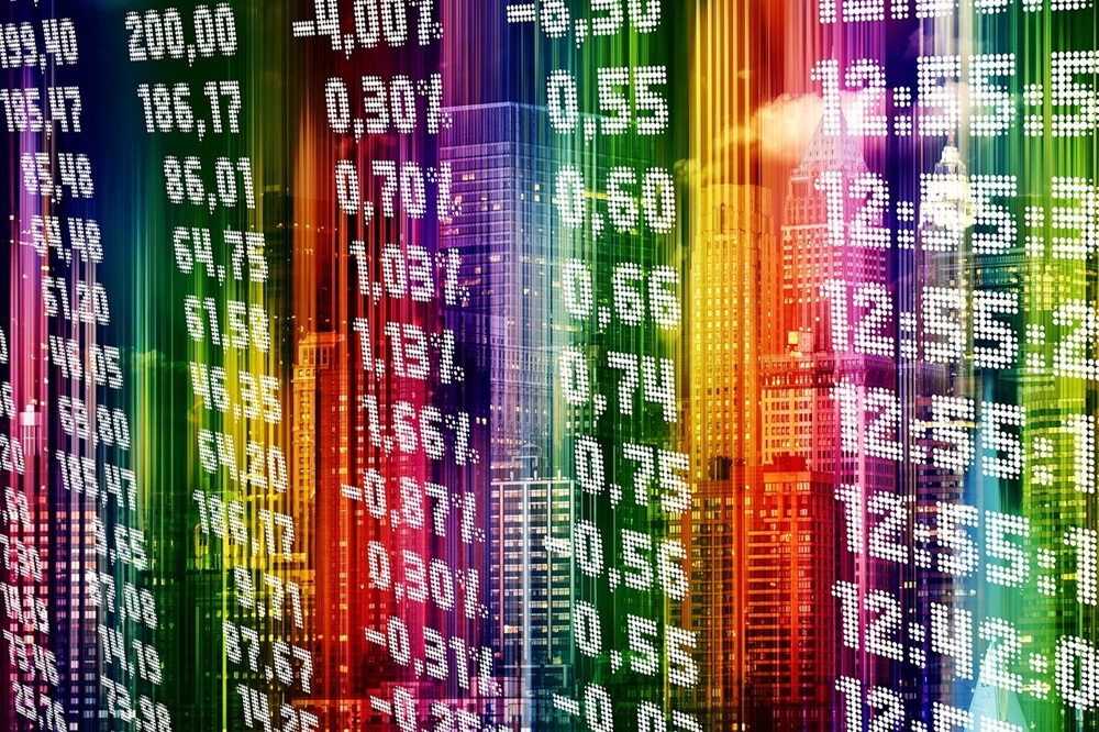 Stock exchange figures backlit with rows of different coloured lights. Credit: Pixabay