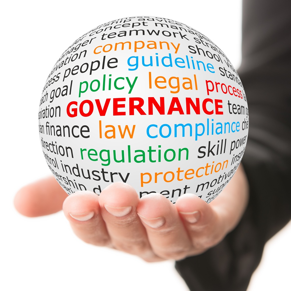 3-D rendering of a white ball being held in a man's hand. On the ball are several key words the largest of which is 'governance'. Credit: Shutterstock